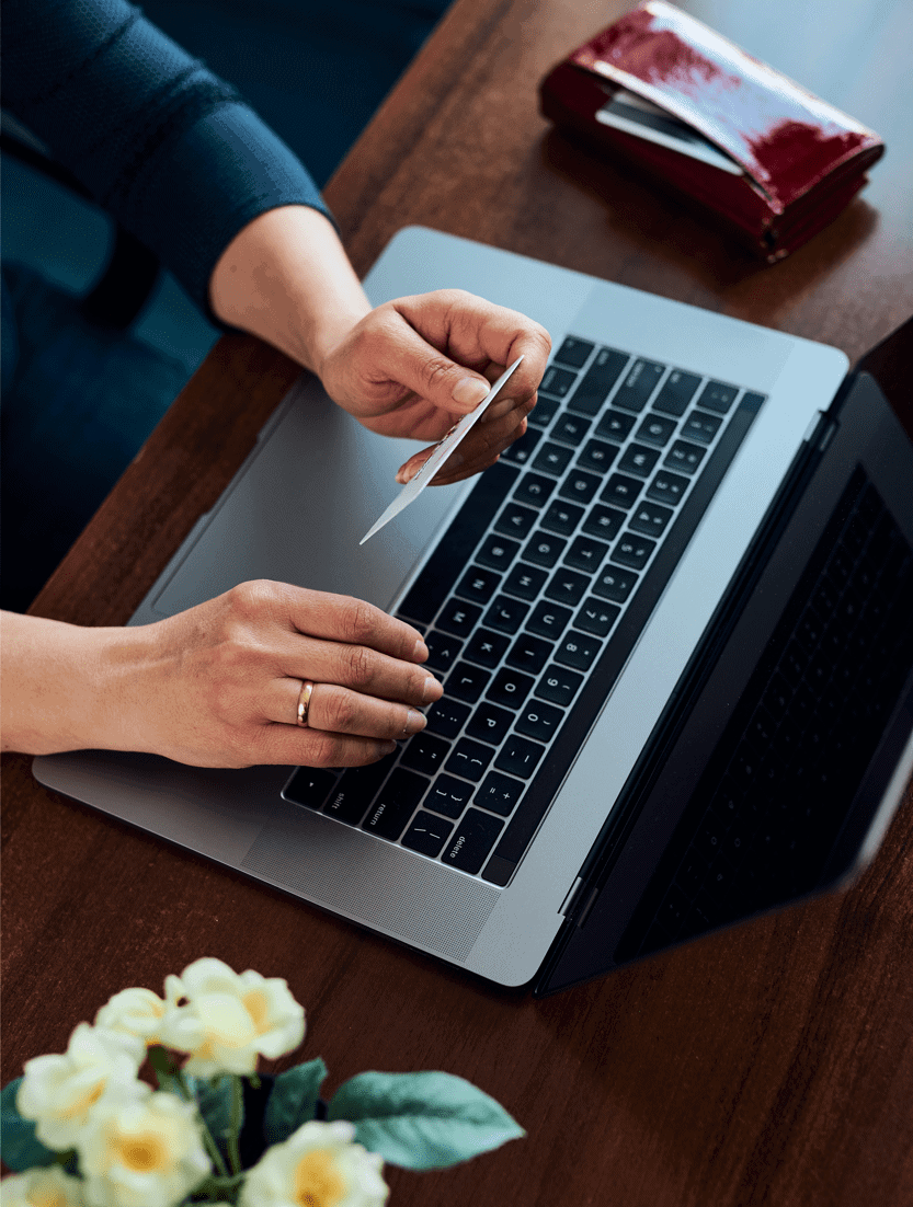 woman-doing-online-shopping-using-debit-card-and-l-A6N8NBM